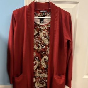 Rust colored cardigan by Cable & Gauge size M. Pockets in front, detailed front